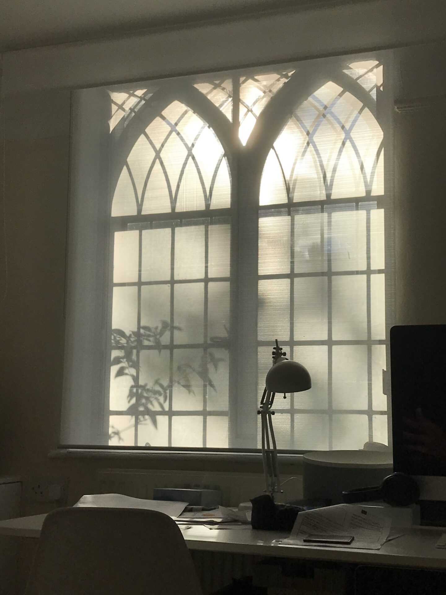 Inside of arched and crossed windows and light reflections