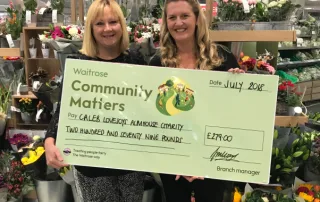 Waitrose Community Matters Cheque with two ladies smiling