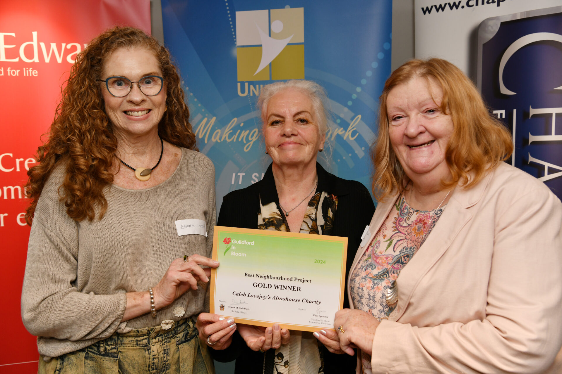 Residents Elmarie Leibold, Marilyn Foulkes and Morwenna Cosh receive a certificate at the Guildford in Bloom awards ceremony 